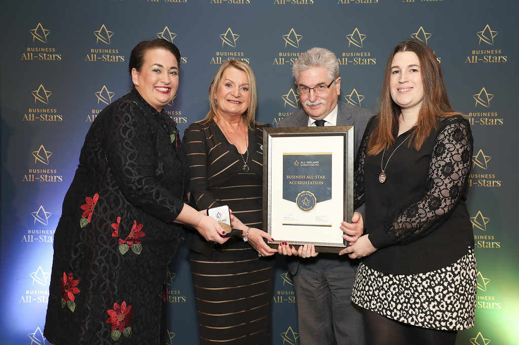 Dee, Regina and Ronan Bushell collecting their All-Ireland Business All-Star accreditation